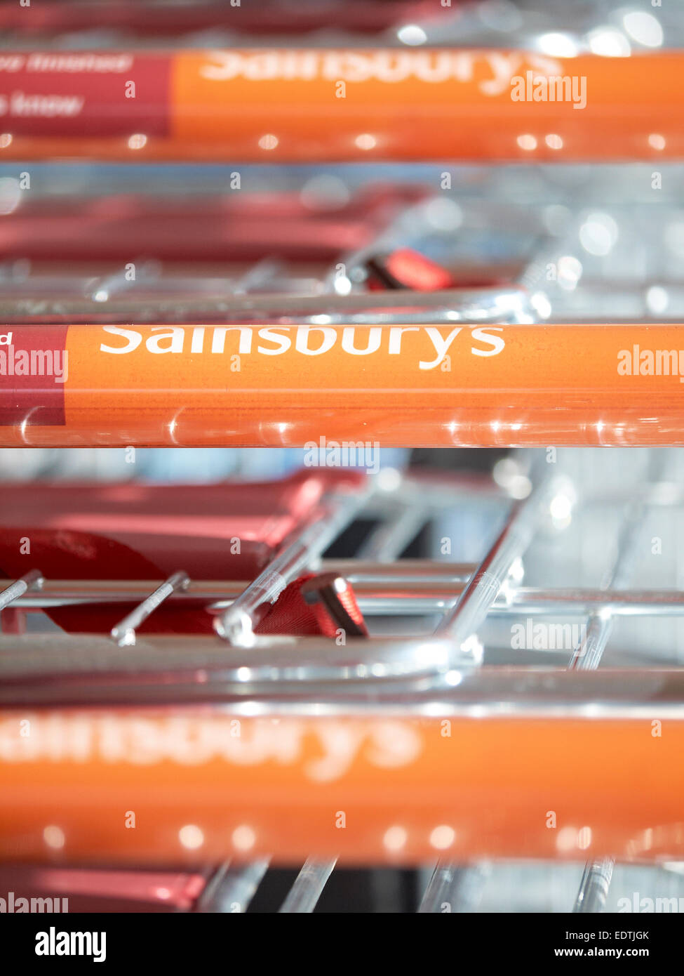 Sainsbury`s logo on empty shopping trolley Stock Photo